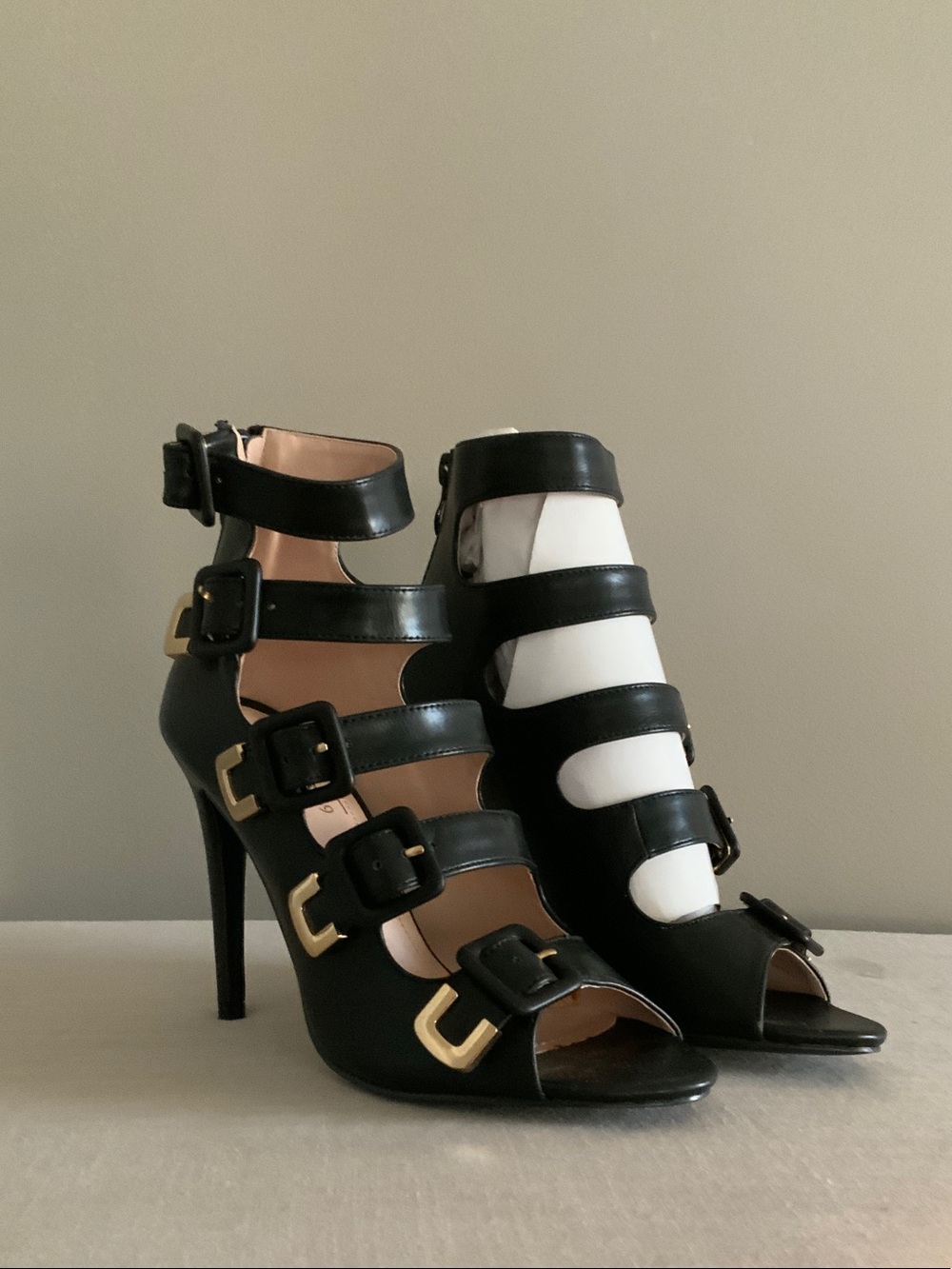 Italina Black Strappy Buckle Stiletto Sandals with Gold Accents